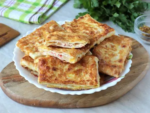 Фото блюда: Конвертики из лаваша с крабовыми палочками (на сковороде)