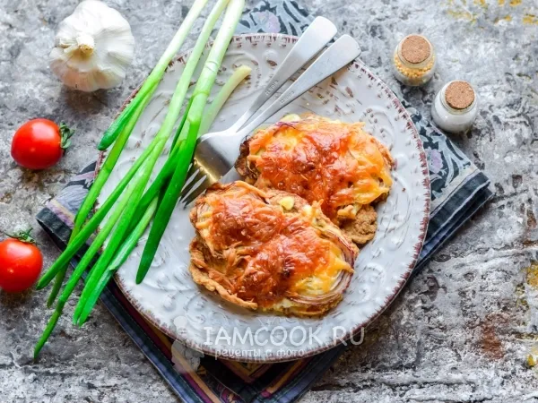 Фото блюда: Отбивные из свинины с чесноком в духовке